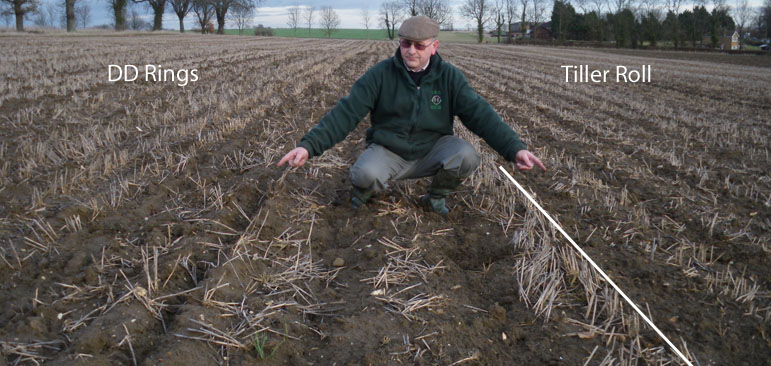 Dean wesley compares his subsoiler with DD rings to the Bristow's tiller roll